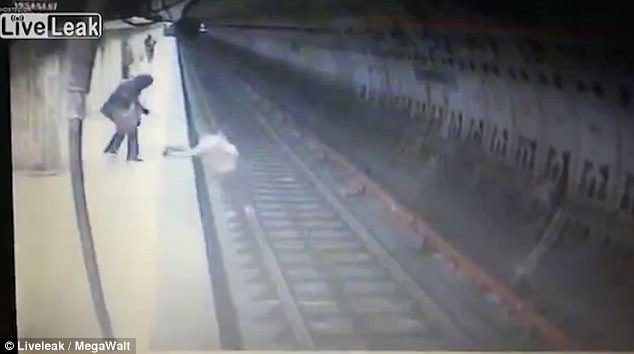 woman thrown in front of train