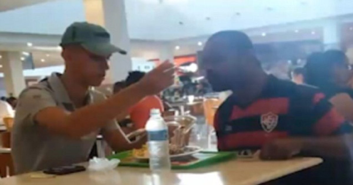 Fast Food Worker Helps Feeds A Customer With One Arm